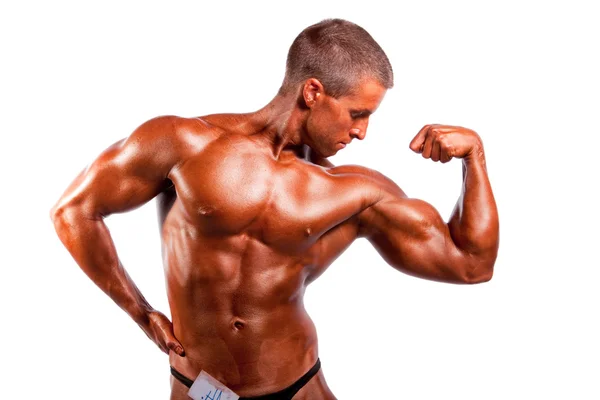 Bodybuilder Posiert Vor Weißem Hintergrund — Stockfoto