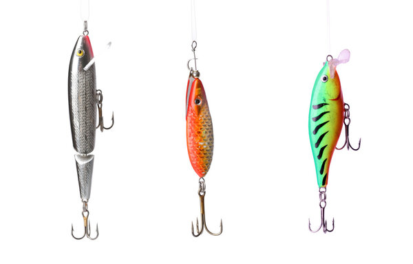 Five fishing lures -floating wobblers hanging in front of white background