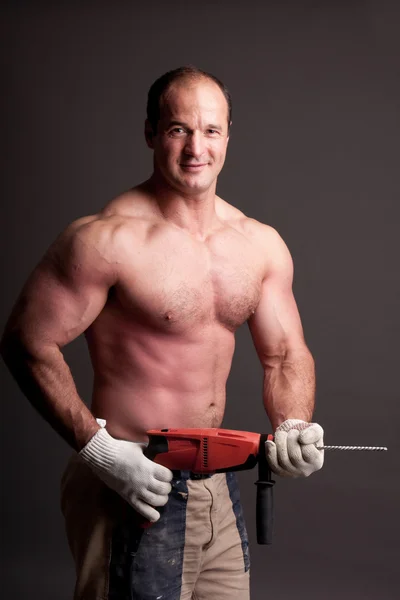 Pracownik budowlany mięśni — Zdjęcie stockowe