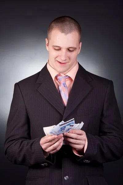 Hombre de negocios con dinero — Foto de Stock