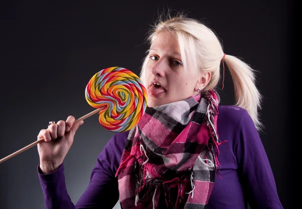 Woman holding lollypop — Stock Photo, Image