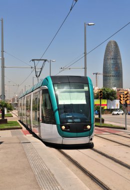 Frontal view from a Barcelona tram with skyscraper Agbar Tower (Spain). clipart