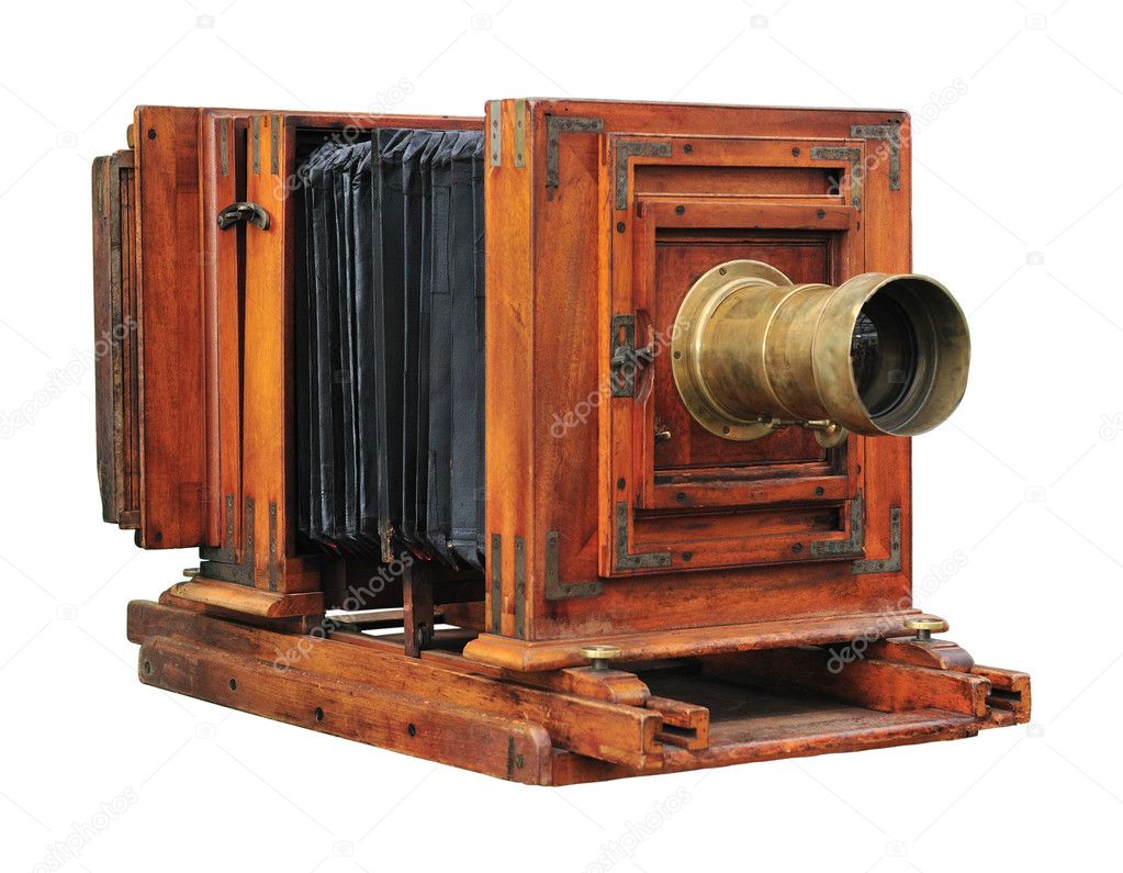 Old wooden folding camera isolated on white.