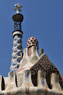 Tiled mosaic Roof of building in Gaudi's Parc Guell at Barcelona (Spain). clipart