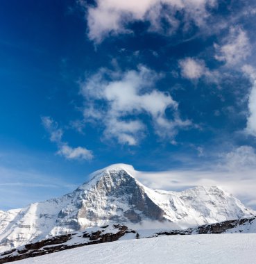 Ski slope in the background of Mount Eiger. clipart