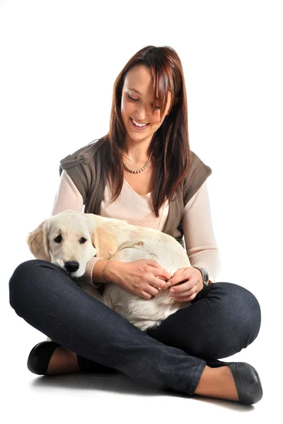 Puppy golden retriever and woman — Stock Photo, Image
