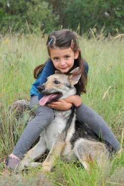 Little girl and her baby purebred wolf dog clipart