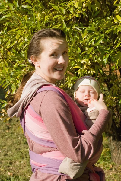 Mama with baby in sling — Stock Photo, Image