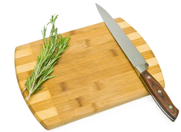 stock image Rosemary on the cutting board with the knife