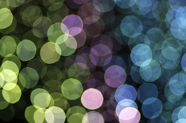 Círculos brilhantes abstratos em um fundo colorido — Fotografia de Stock