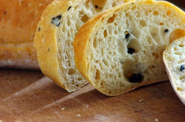 stock image Close-up on traditional bread with olive. Shallow DOF