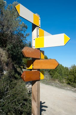 Wooden hiking trail signpost with multiple directions, signs empty for text clipart