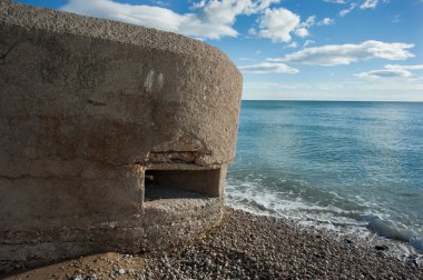 Historic military fortified lookout post on the coast clipart