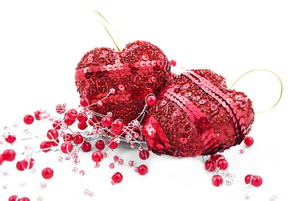 Two red hearts and beads — Stock Photo, Image