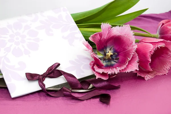 Greeting card with violet tulips — Stock Photo, Image