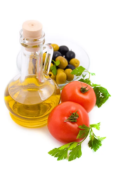 Olive oil, tomatoes and greens — Stock Photo, Image