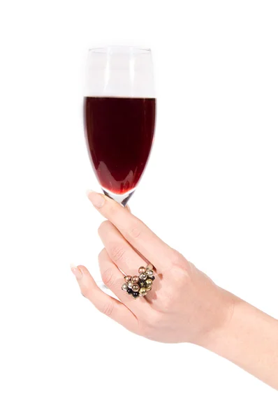 Woman hand with ring holding glass of wine — Stock Photo, Image