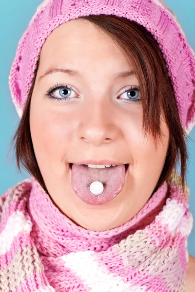 Pill on the tongue — Stock fotografie
