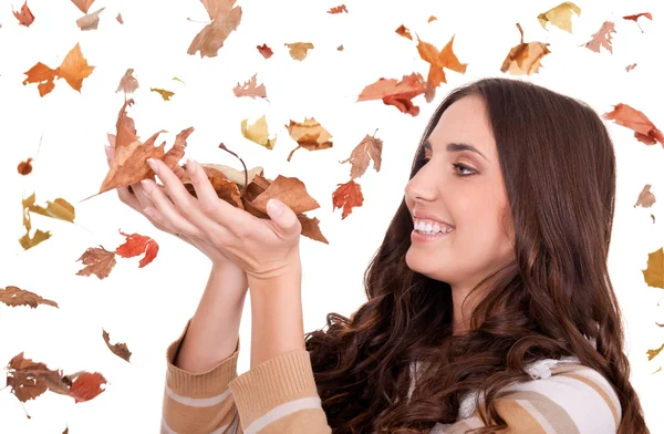 Beautiful woman holding autumn leaves — Stock Photo, Image