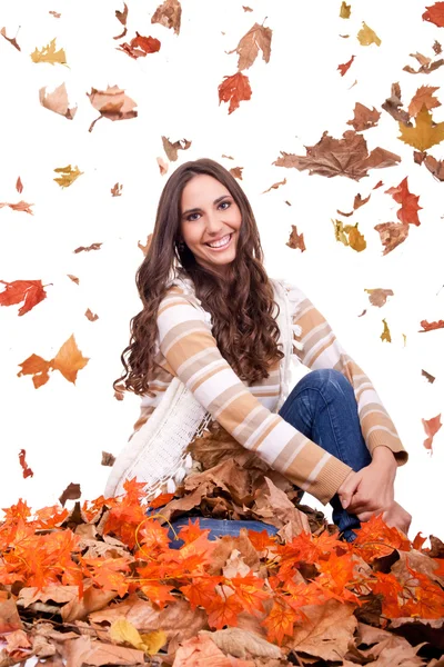 Attractive autumn woman and falling leaves — Stock Photo, Image