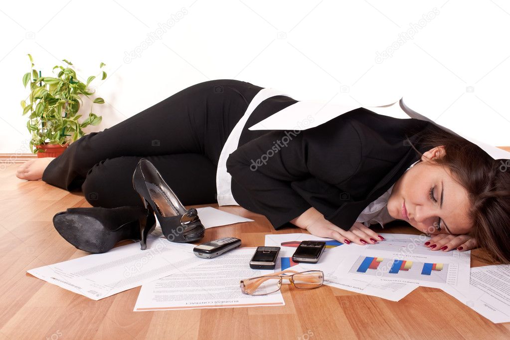 Business woman sleeping on floor