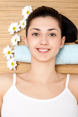 Woman lying on a massage table clipart