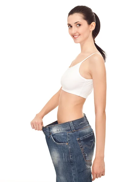 Woman showing lost weight — Stock Photo, Image