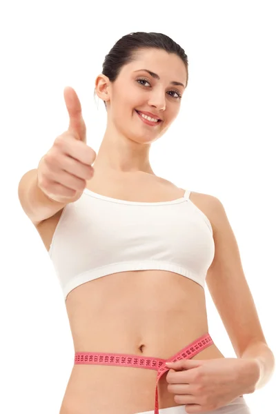 Successful girl measuring her belly — Stock Photo, Image