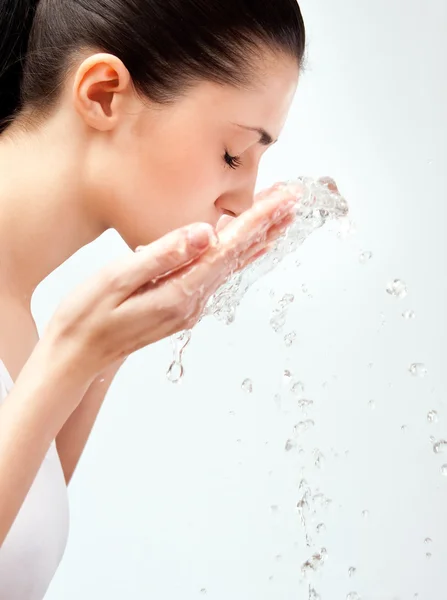 Woman wash her face Stock Photo