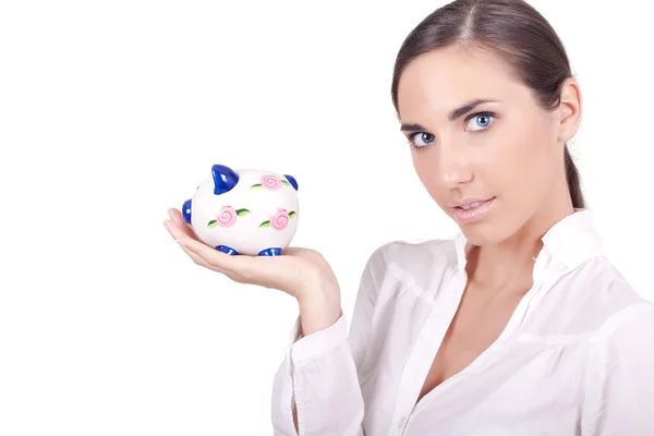 Businesswoman holding a piggibank — Stock Photo, Image