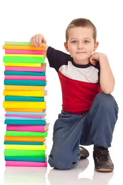 Preschooler and big stack books — Stock Photo, Image