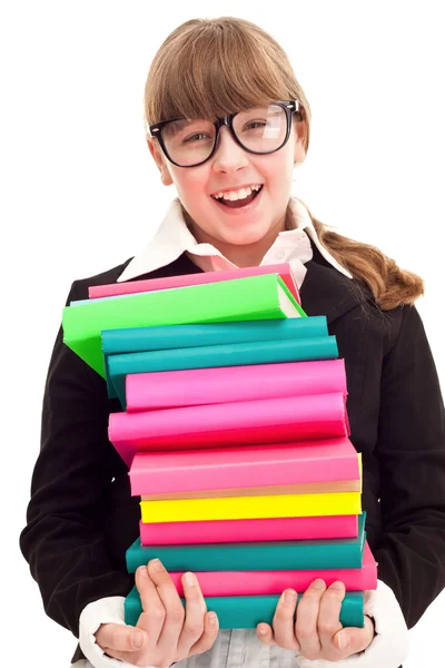 Schoolgirl carrying color stack books — Stock Photo, Image