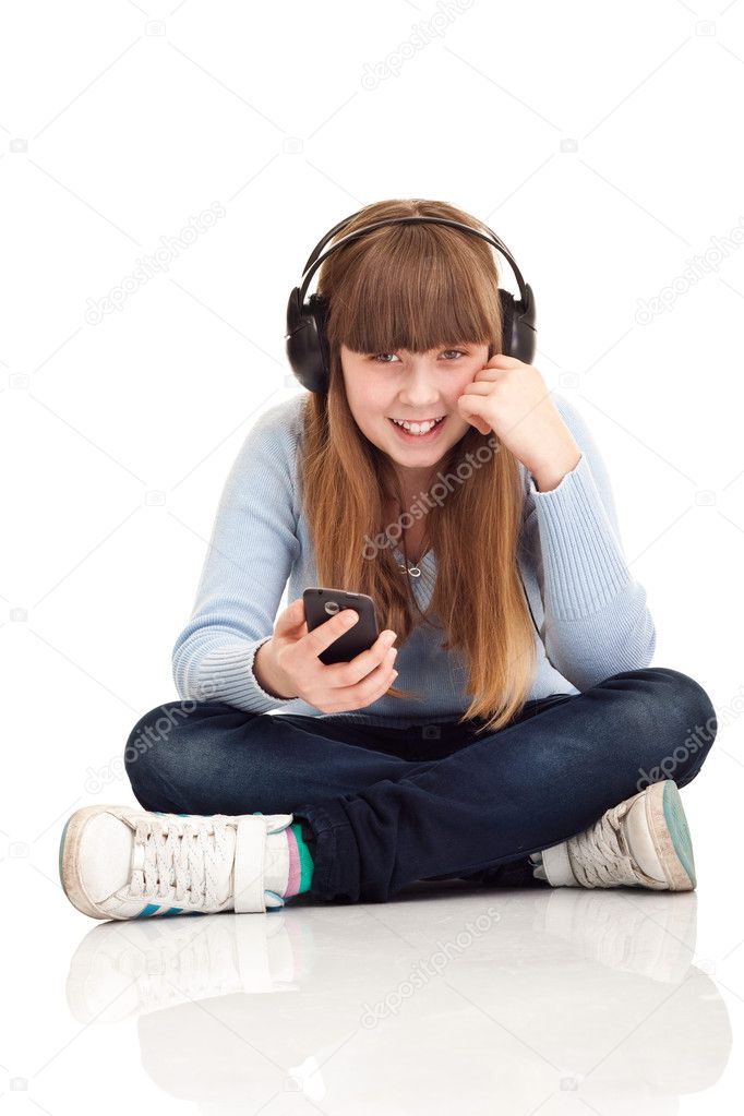 Girl listening to music on MP3 player