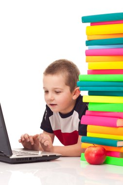 Boy typing on laptop clipart