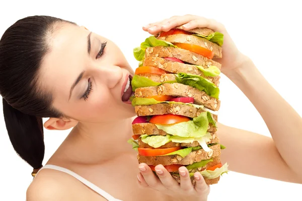 Girl eating sandwich, big bite — Stock Photo, Image