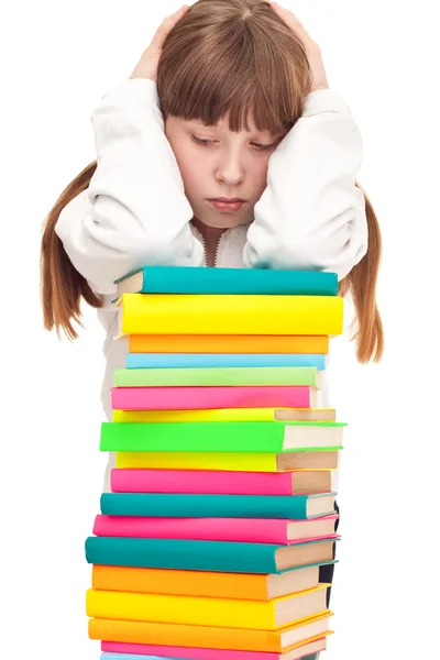 Upset schoolgirl with books — Stock Photo, Image