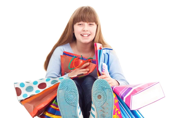 Teen girl holding gift bags — Stock Photo, Image