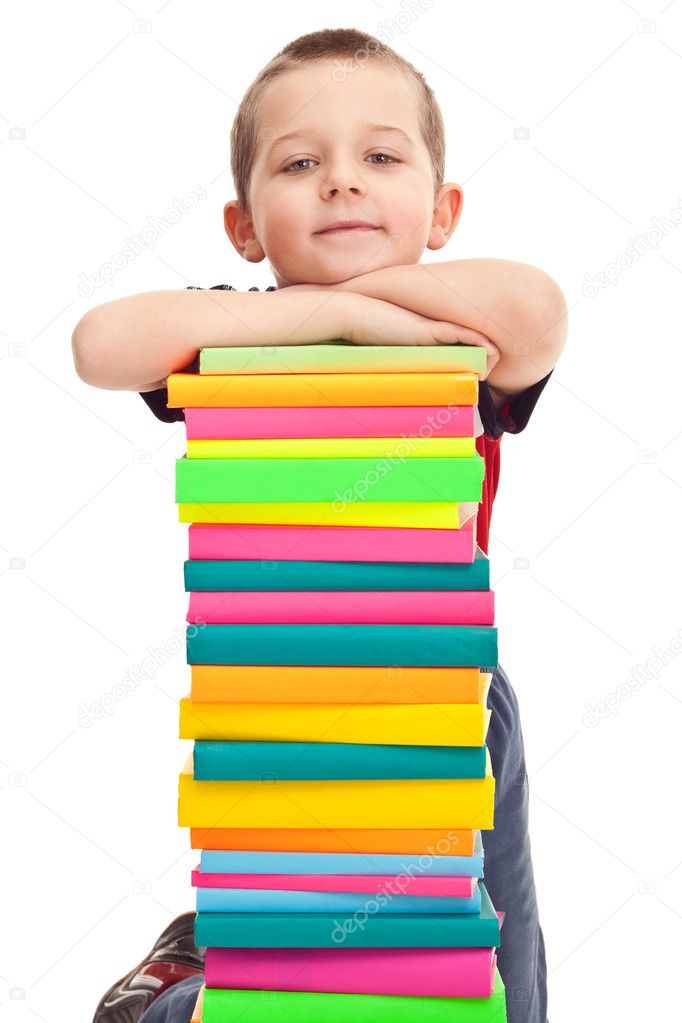 Little boy with pile of books