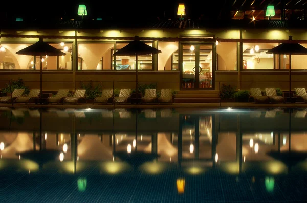 stock image Night swimming pool side of tropical hotel