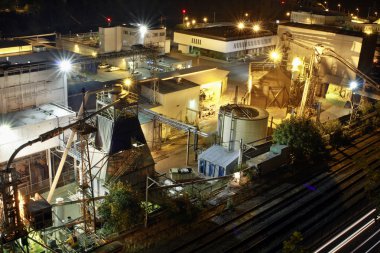 Lumber Paper Mill at Night 2 clipart