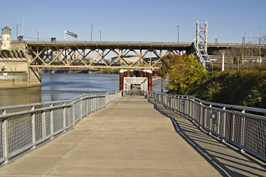Cyclist and Pedestrian Path by Willamette River clipart