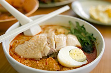 Chicken Curry Noodles at Singapore Hawker Foods Center clipart