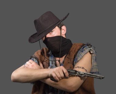 Cowboy with revolver isolated on grey background.Shallow DOF clipart