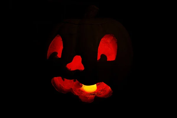 Red glow of a jack o'lantern face — Stock Photo, Image