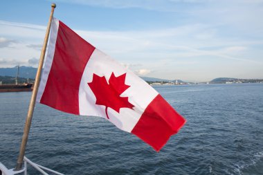 Canadian flag over a bay clipart