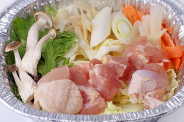 Chanko nabe (shiabu-shiabu) ingredients.Specific Japanese food,an important part of the sumo wrestlers menu.Here in a casserolle-close-up image clipart