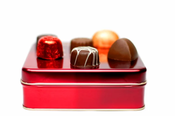 Assortiment van Chokoladen op een rood vak — Stockfoto