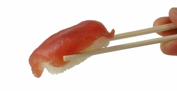Tuna sushi in chopsticks — Stock Photo, Image