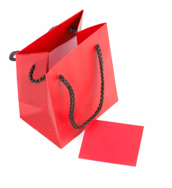 Saco vermelho e cartão — Fotografia de Stock