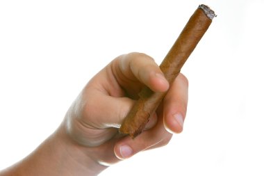 Cigarets in a hand on a white background, the young man smokes a cigar clipart